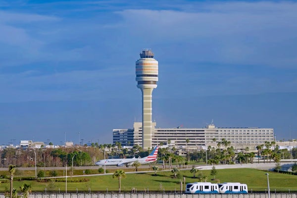 The control tower and people mover at Orlando International Airport.